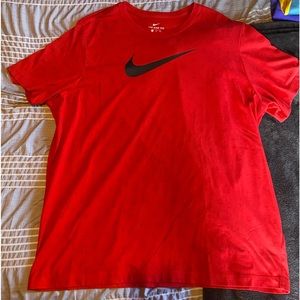 The Nike Tee Dri-Fit  Red Swoosh Logo
